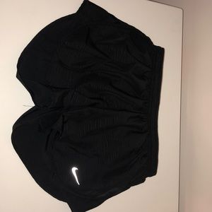 Black Nike running shorts